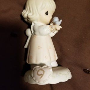16 Precious moments figurines/books
